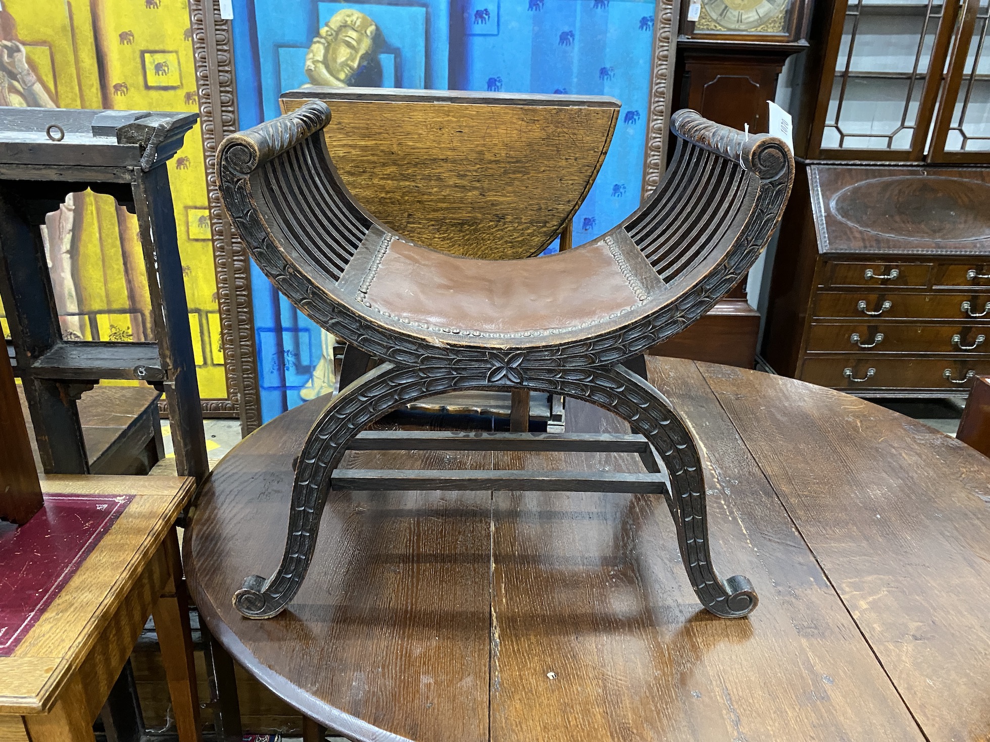 An Edwardian beech 'X' frame dressing stool, width 58cm, height 60cm, together with a small 1920's oak drop flap occasional table